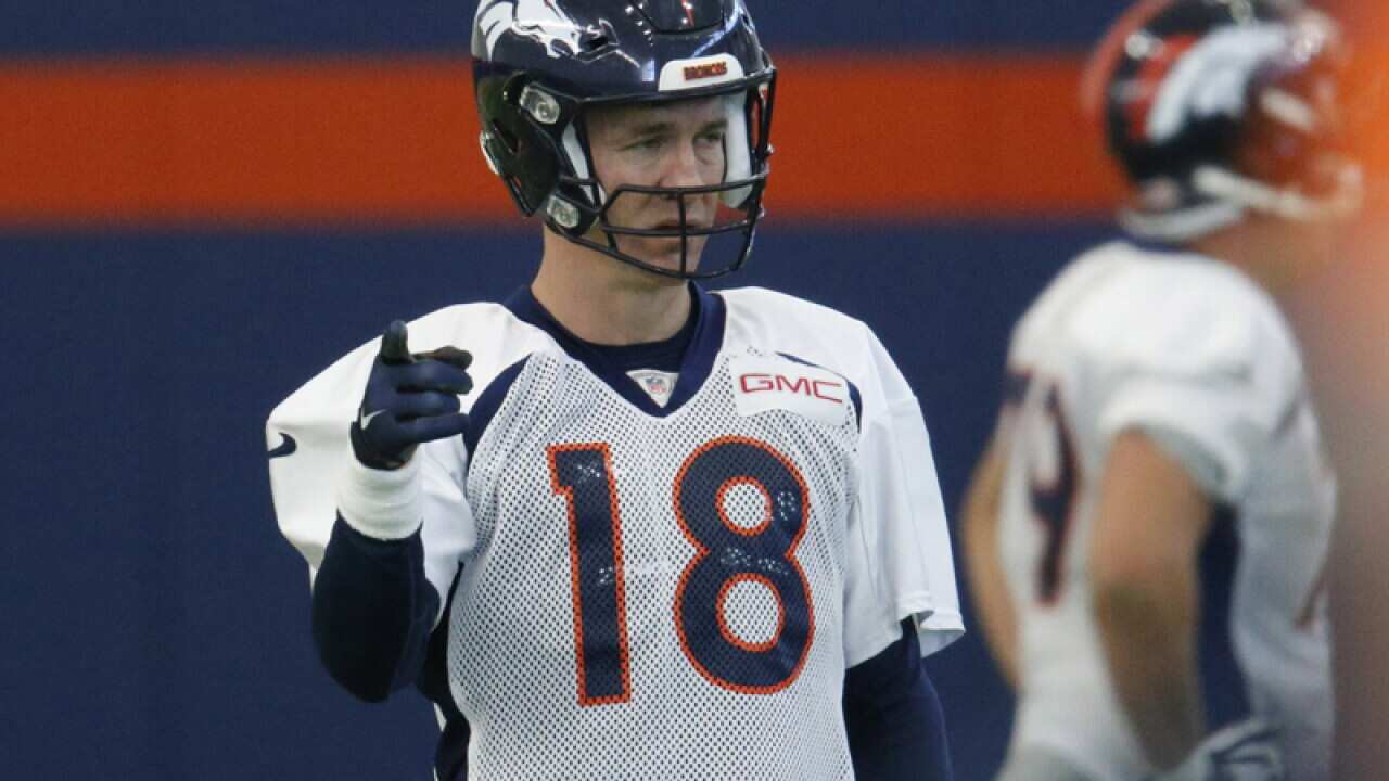 Injured Denver Broncos quarterback Peyton Manning