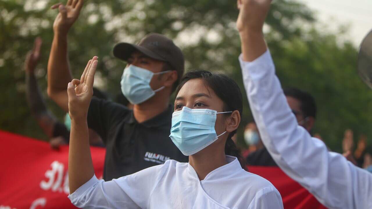 Demonstrators flash the three-finger salute during an anti-military coup protest in Mandalay, Myanmar, 10 May 2021.