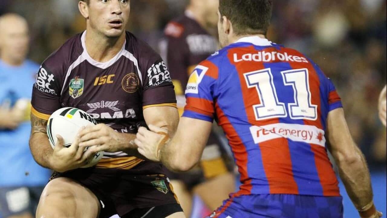Matt Gillett of the Broncos in action against Lachlan Fitzgibbon.