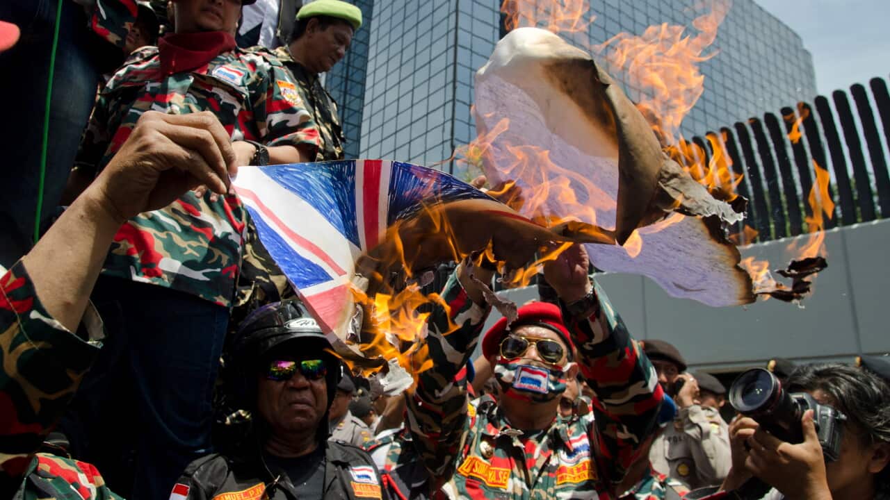 Protesters burn an Australian flag in front of Australian Embassy in Jakarta - AAP2.jpg