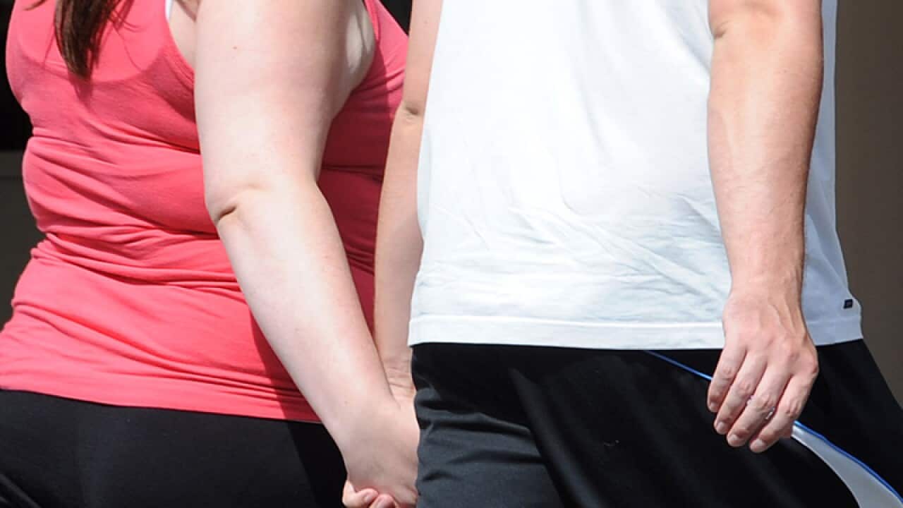 A couple go about their daily routine in Melbourne