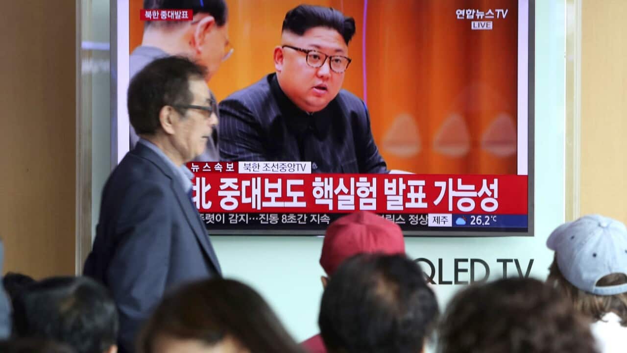 People watch a TV news program showing North Korean leader Kim Jong Un at the Seoul Railway Station in Seoul, Sunday, Sept. 3, 2017.