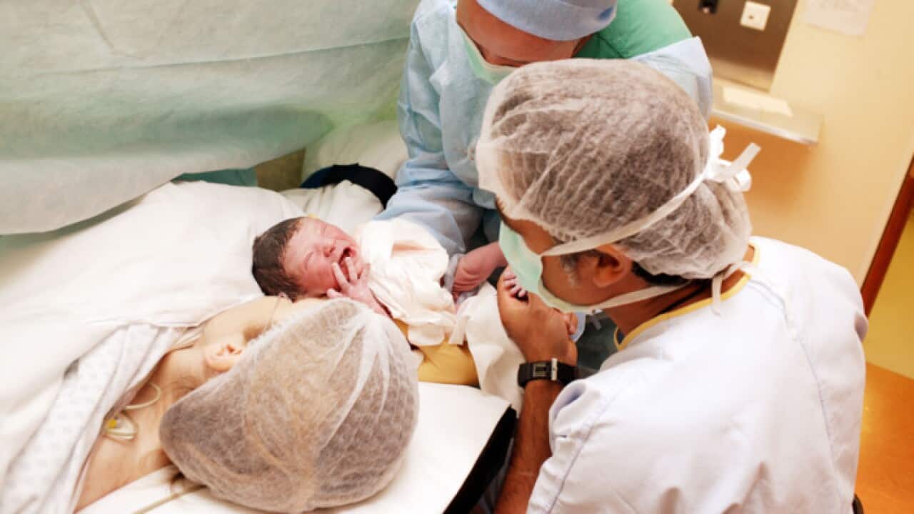 Mother with newborn baby