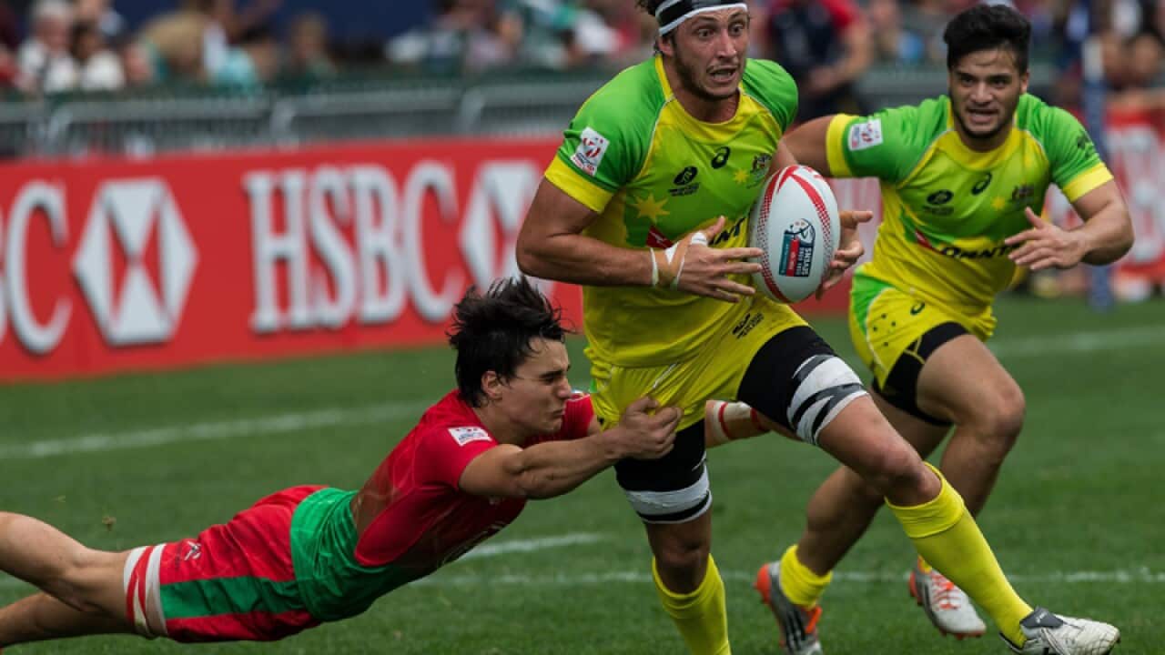 Australia's Sam Myers is tackled