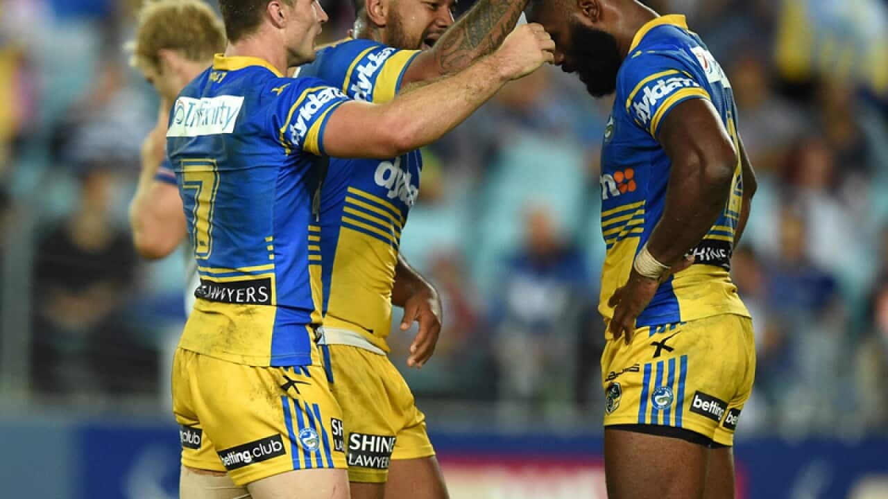 Semi Radradra celebrates with teammates after scoring a try