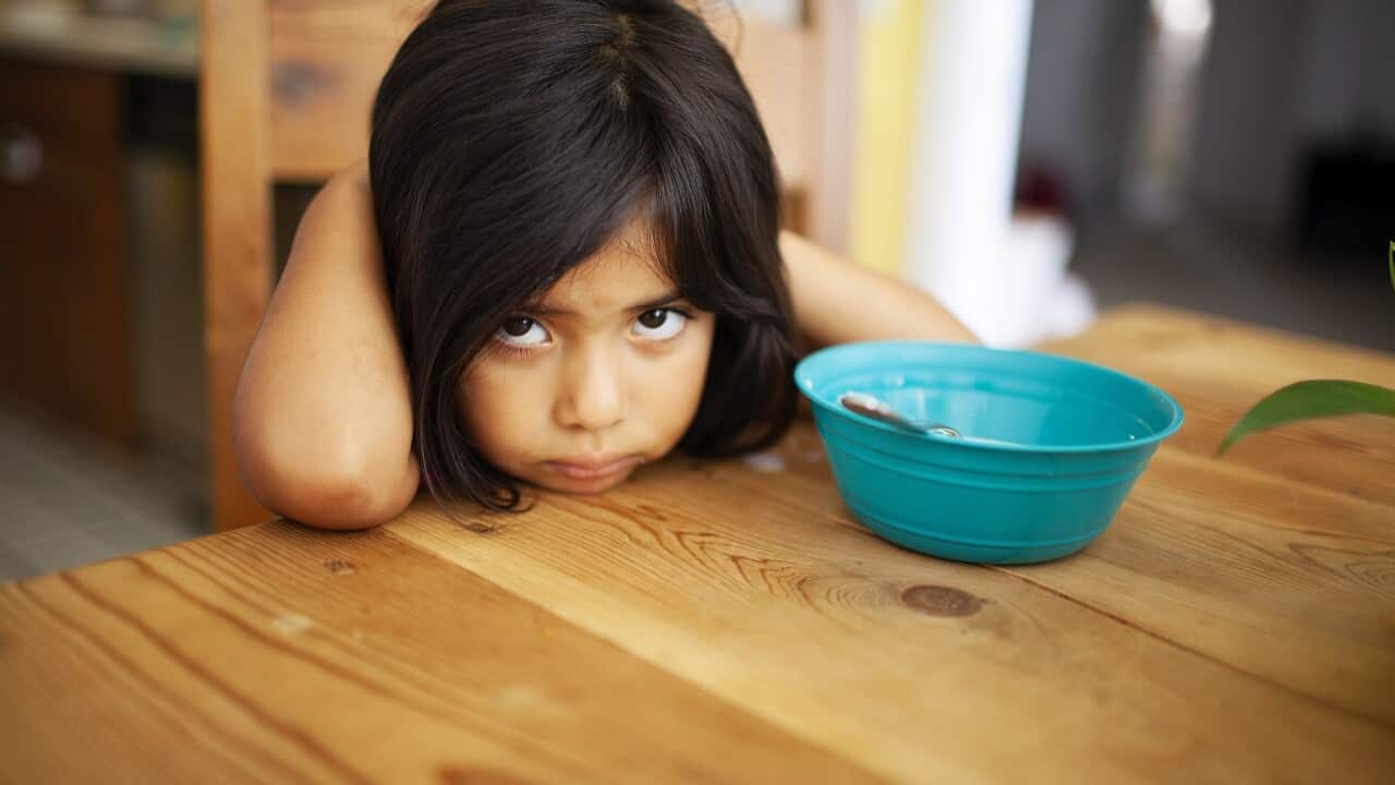 Girl Upset at Kitchen Table