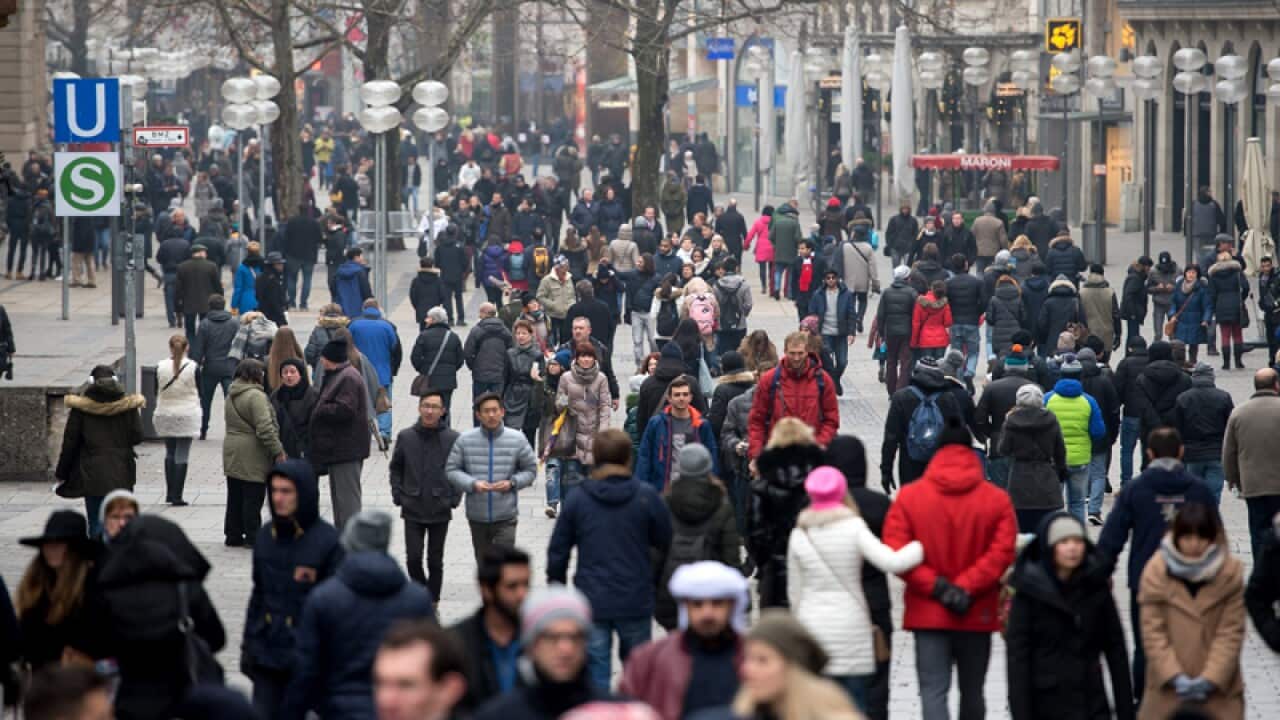 Police officer walk through the city centre of Munich