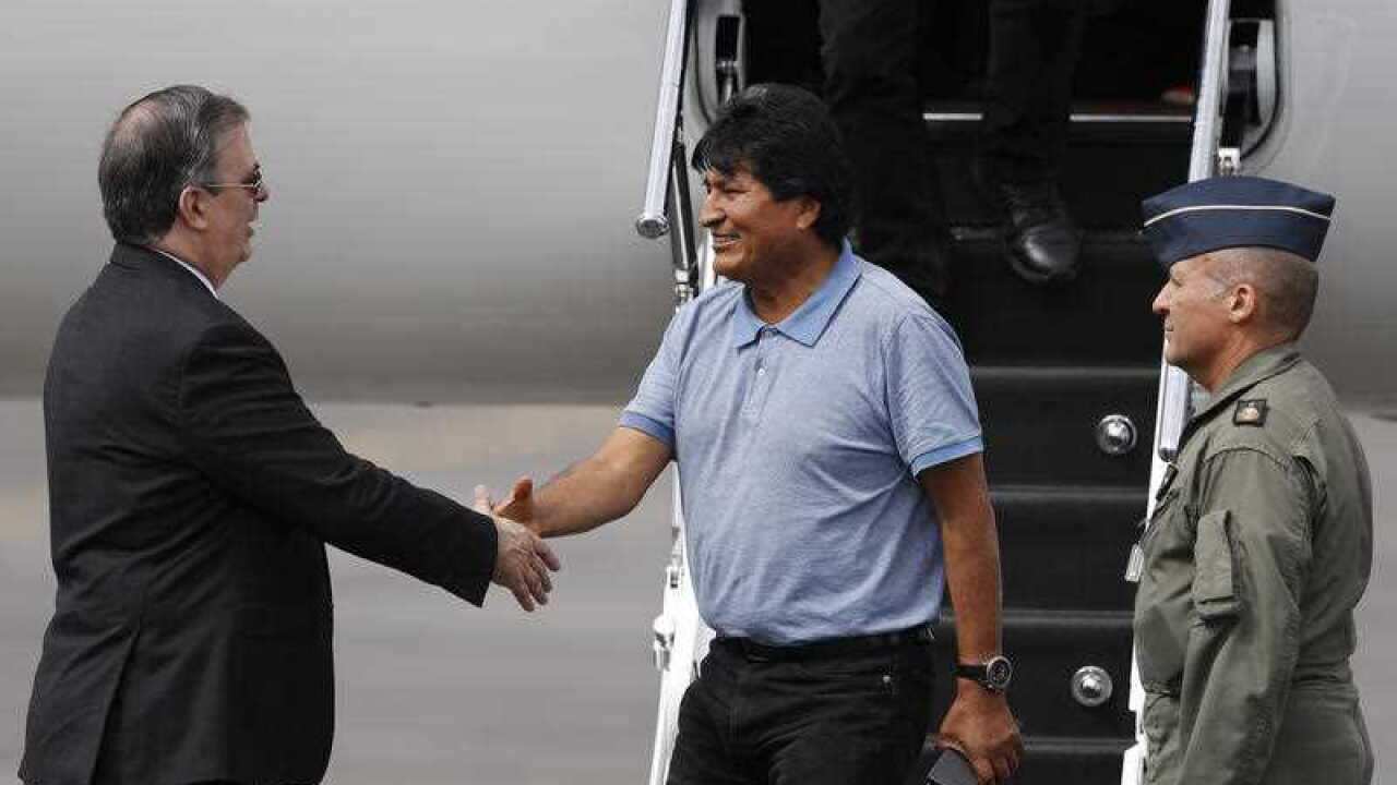 Evo Morales lands in Mexico where he has been offered asylum after resigning as president of Bolivia