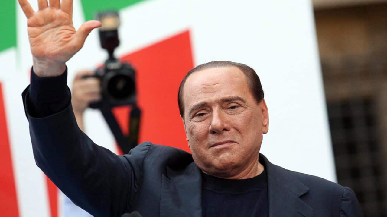 'I'm staying here,' Berlusconi says