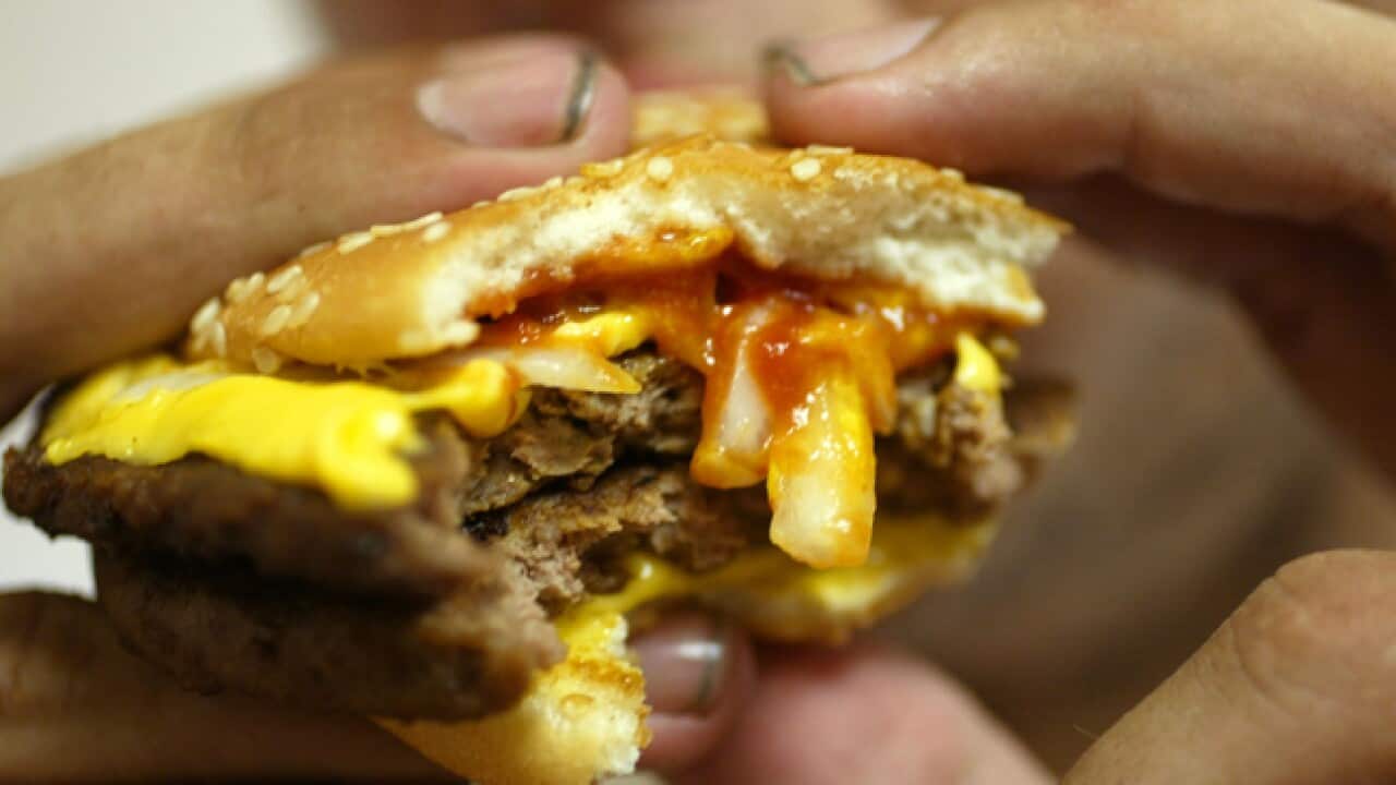 Burger_eating_generic_b_111220_getty_486967241