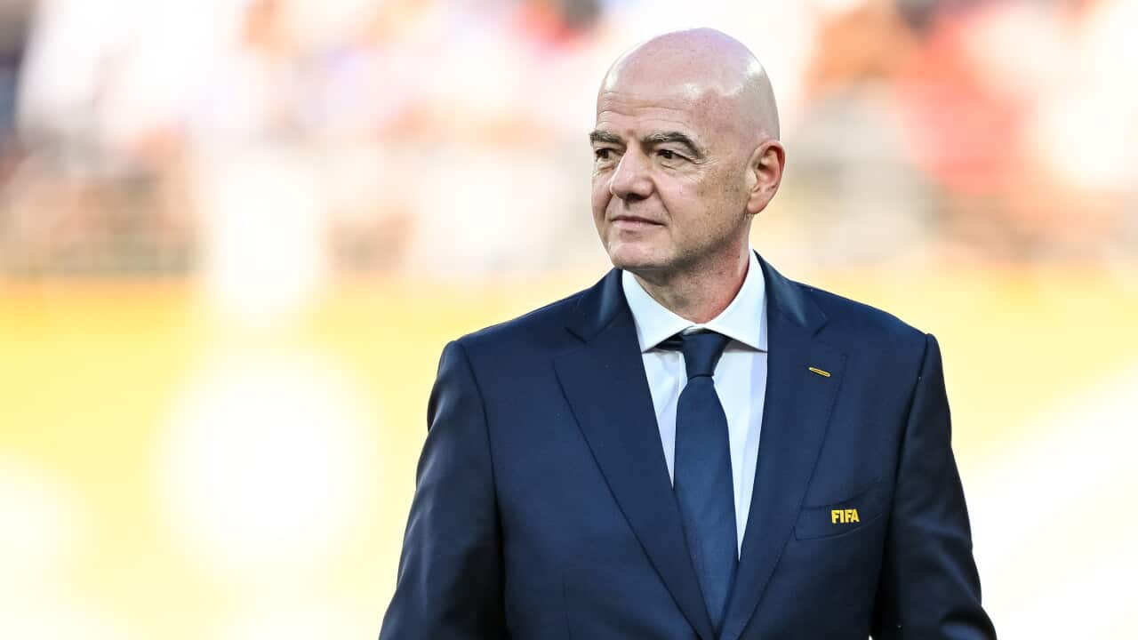 A middle-aged white man in a suit
