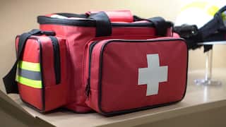 red-first-aid-equipment-emergency-bag-for-accident-disaster-SBI-350964882.jpg