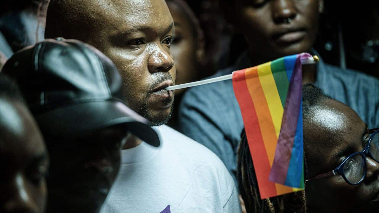 LGBTQ community members and supporters listen to a verdict on scrapping laws criminalising homosexuality at the Milimani high court in Nairobi, Kenya