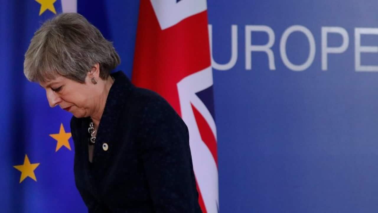 British Prime Minister Theresa May leaves an EU summit in Brussels