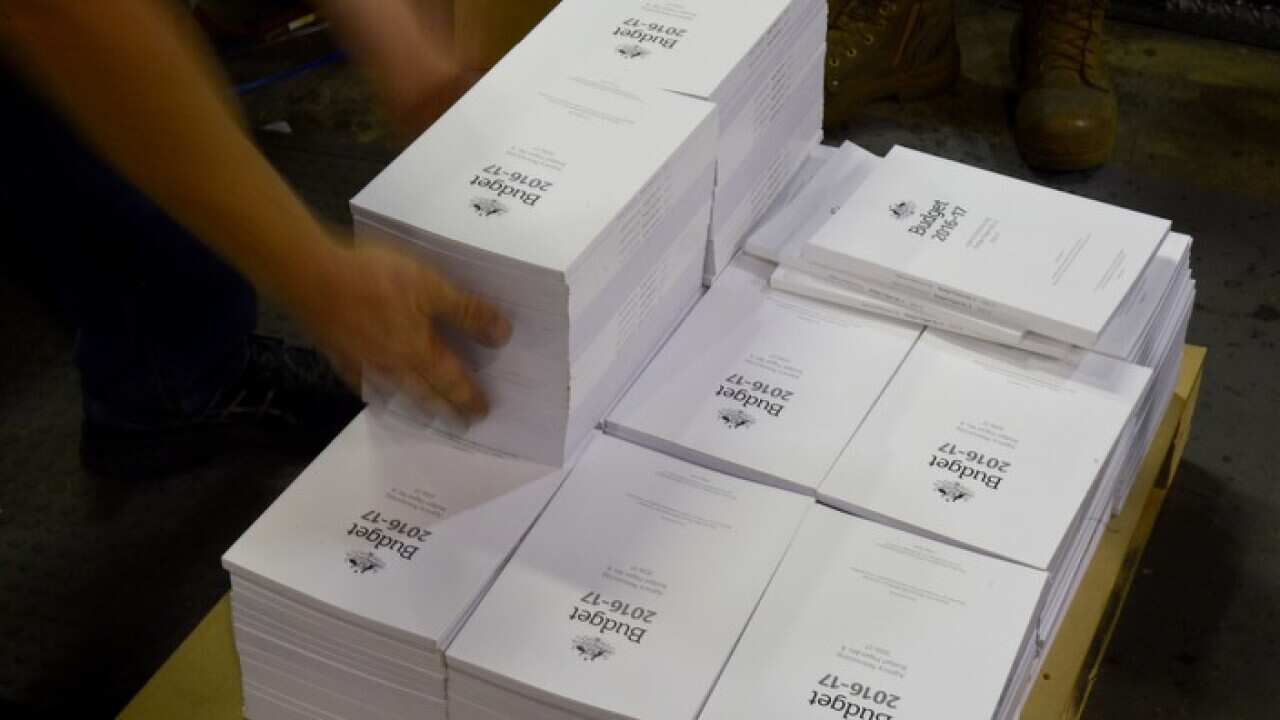 The 2016-2017 Budget Papers are seen at a printing facility prior to being delivered to Parliament House in Canberra, Sunday, May 1, 2016. (AAP Image/Mick Tsikas) NO ARCHIVING