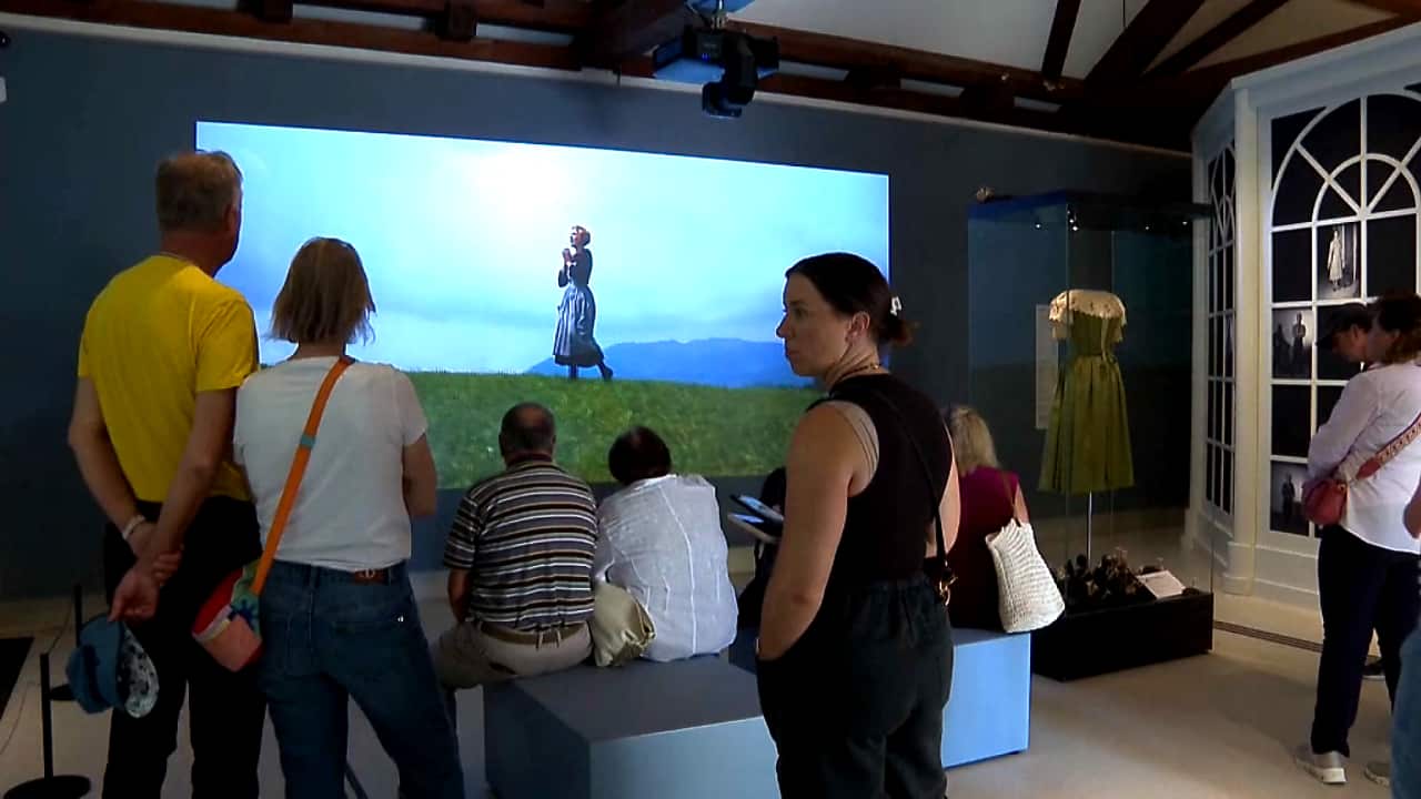 Visitors to the museum watching an extract from 'The Sound of Music' (AP).png