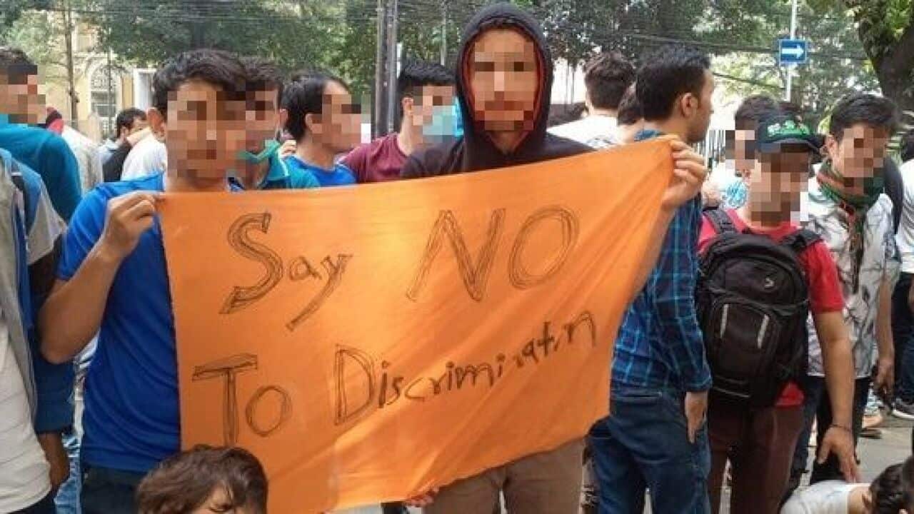 Hazara refugee Reza Akbari (centre) has been waiting for eight years to be resettled to another country after fleeing Pakistan.