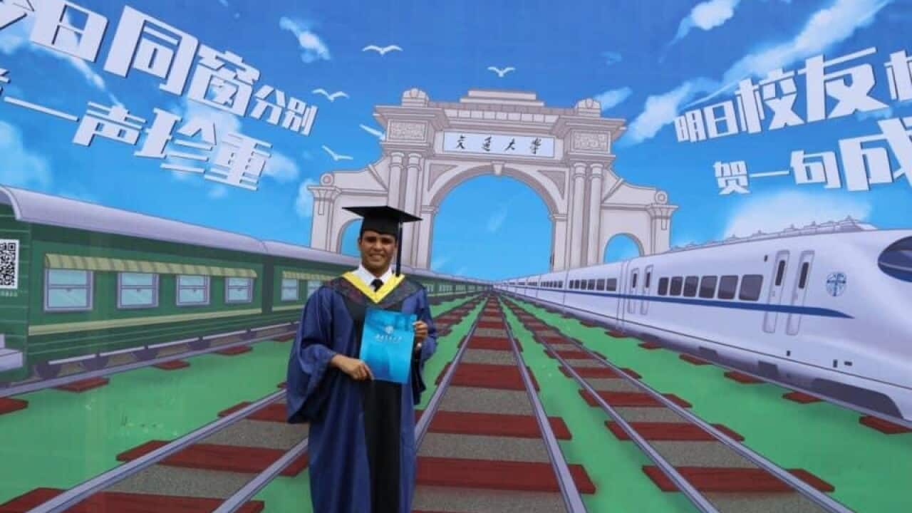 Mohammad AlMafri Graduaion In China with Gawn.jpg