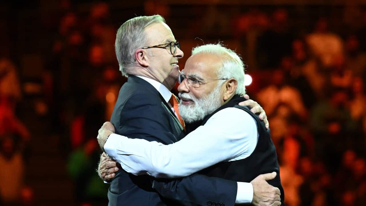 India’s Prime Minister Narendra Modi (right) and Australian Prime Minister Anthony Albanese embrace