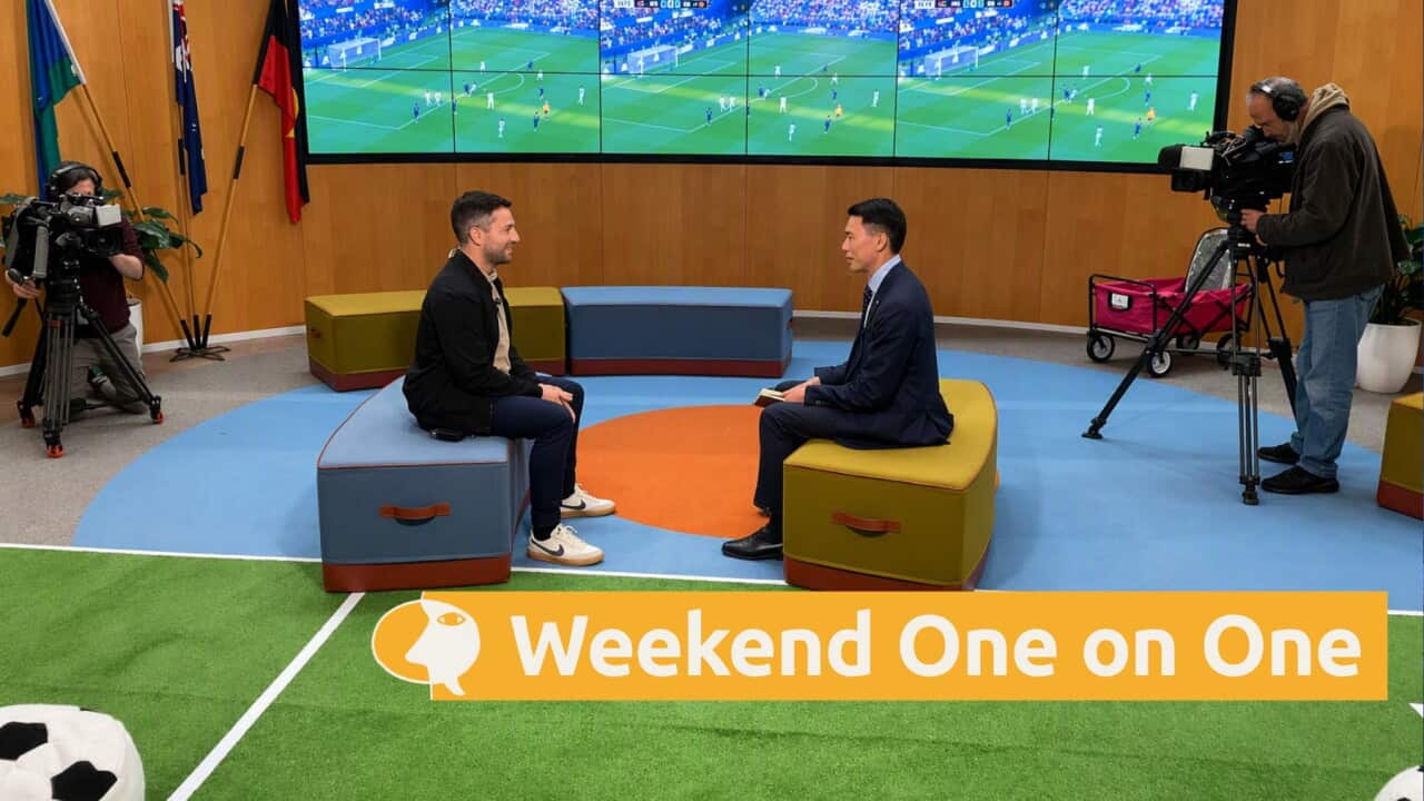 Chris Tan speaks to former Socceroo Tommy Oar (left) (SBS-Marcus Megalokonomos).jpg