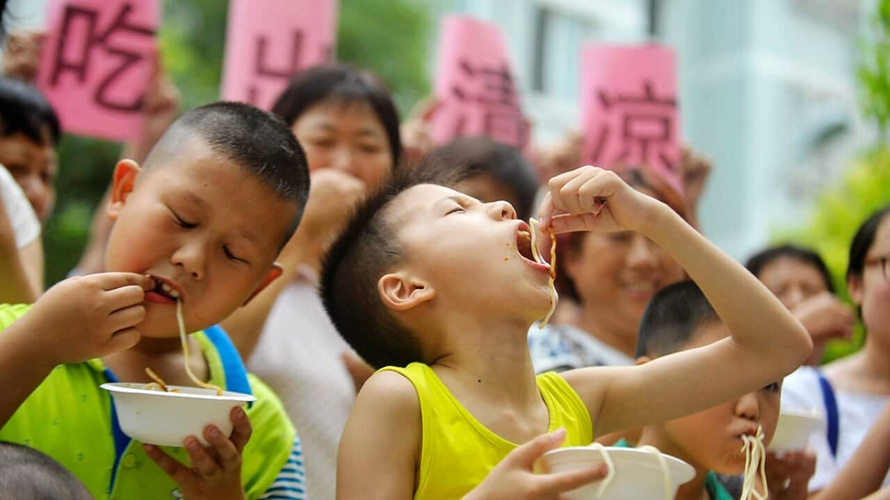 Children eat noodles in Yangzhou, China
