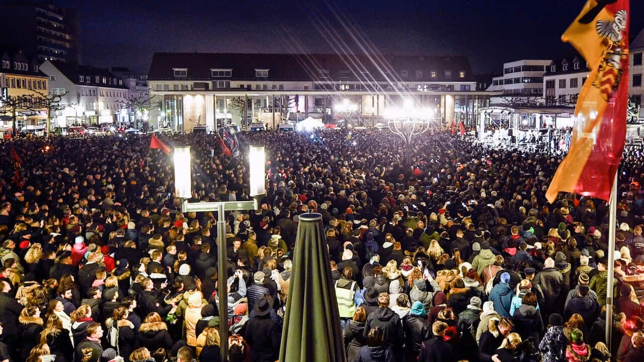Thousands listen to German president Frank-Walter Steinmeier during a vigil for the victims of Hanau shooting