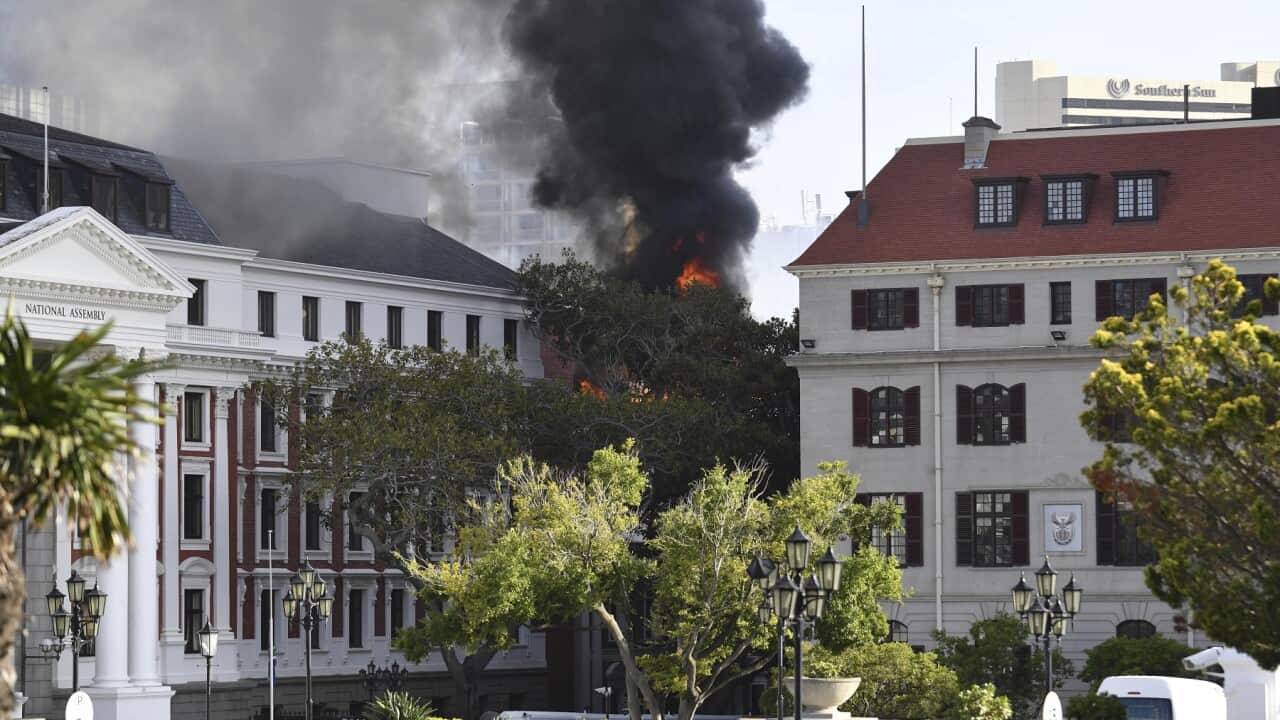 A fire burns at the Houses of Parliament, in Cape Town, South Africa
