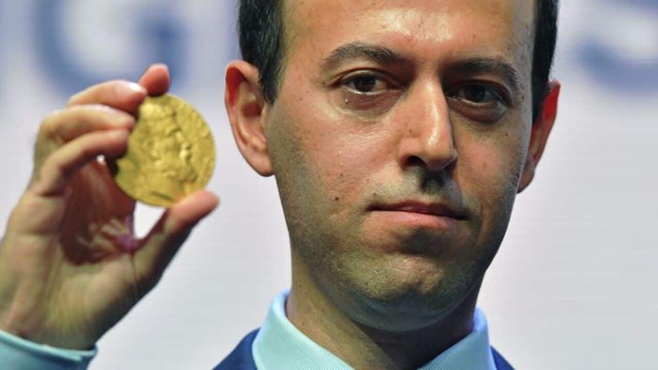 Kurdish refugee turned Cambridge University professor Caucher Birkar, with his Fields Medal for Mathematics