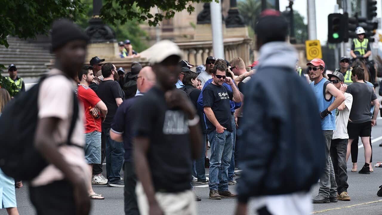 African-Australian youth are seen at a True Blue Crew and United Patriots Front rally to celebrate Donald Trump's election to the U.S. Presidency at State parliament in Melbourne, Sunday, Nov. 20, 2016. (AAP Image) NO ARCHIVING