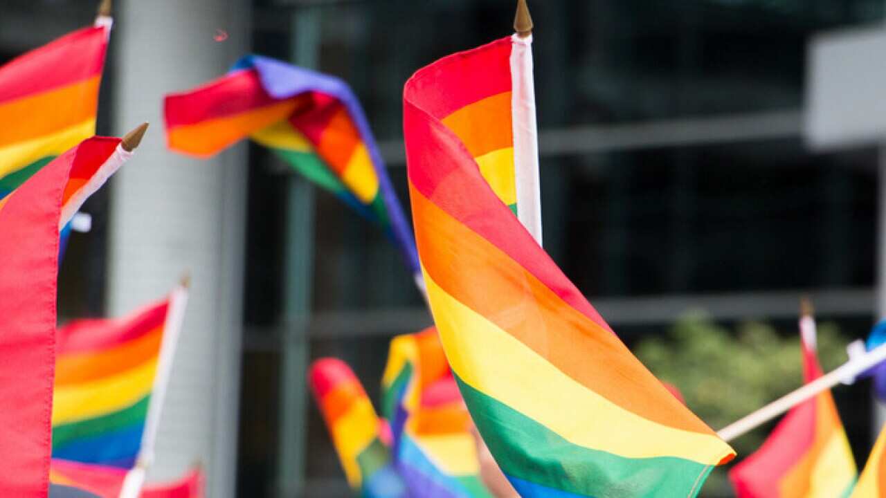 CANADA, Montreal: Rainbow flags are waved during Montreal's Pride Parade on August 14, 2016. The parade took place on Rene-Levesque st. A minute of silence was observed in memory of Orlando's shooting victims. (AAP Image/NEWZULU/Josie Desmarais).