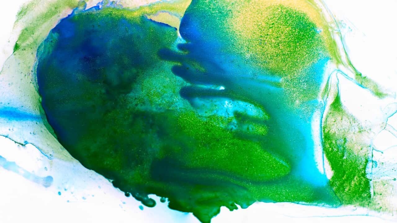 Heart shape spot of fluid, green and blue