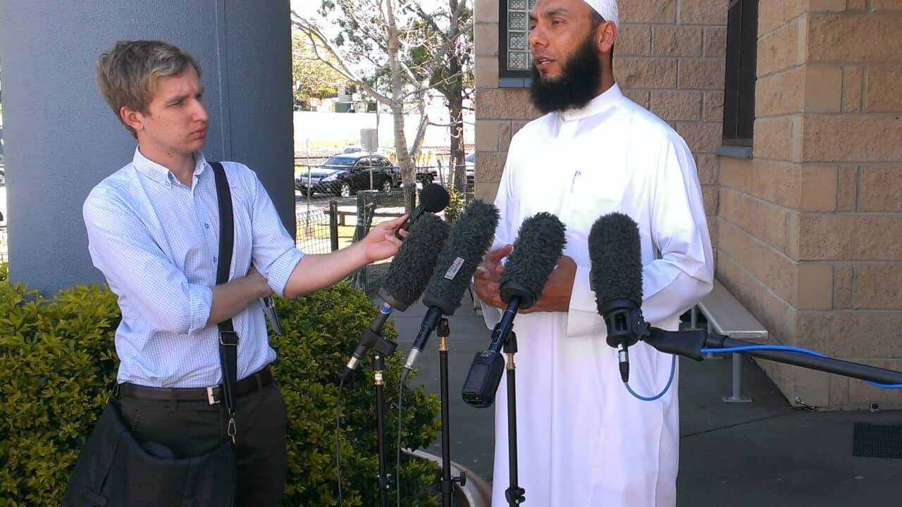 Dr Mohamad Abdalla, the acting Imam of the Kuraby Mosque, joins Christian denomination leaders to show solidarity against religious vilification, Friday, Sept. 26, 2014. (AAP/Jamie McKinnell)