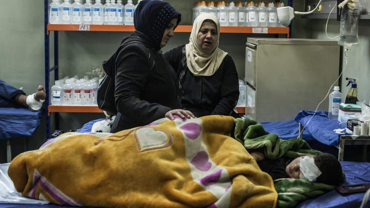 The mother and aunt of a boy wounded in a car bomb attack in the district of Gogjali in Mosul comfort him in a hospital in Irbil, Iraq, Thursday, Dec. 22, 2016.(AP Photo/Manu Brabo)