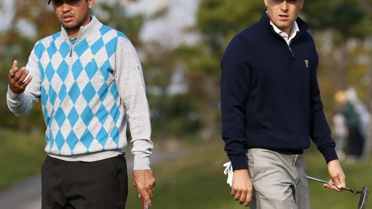 International team player Jason Day and United States' Jordan Spieth