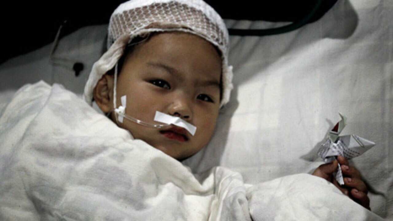 china_knifeattack_victim_100513_L_AAP_906651494