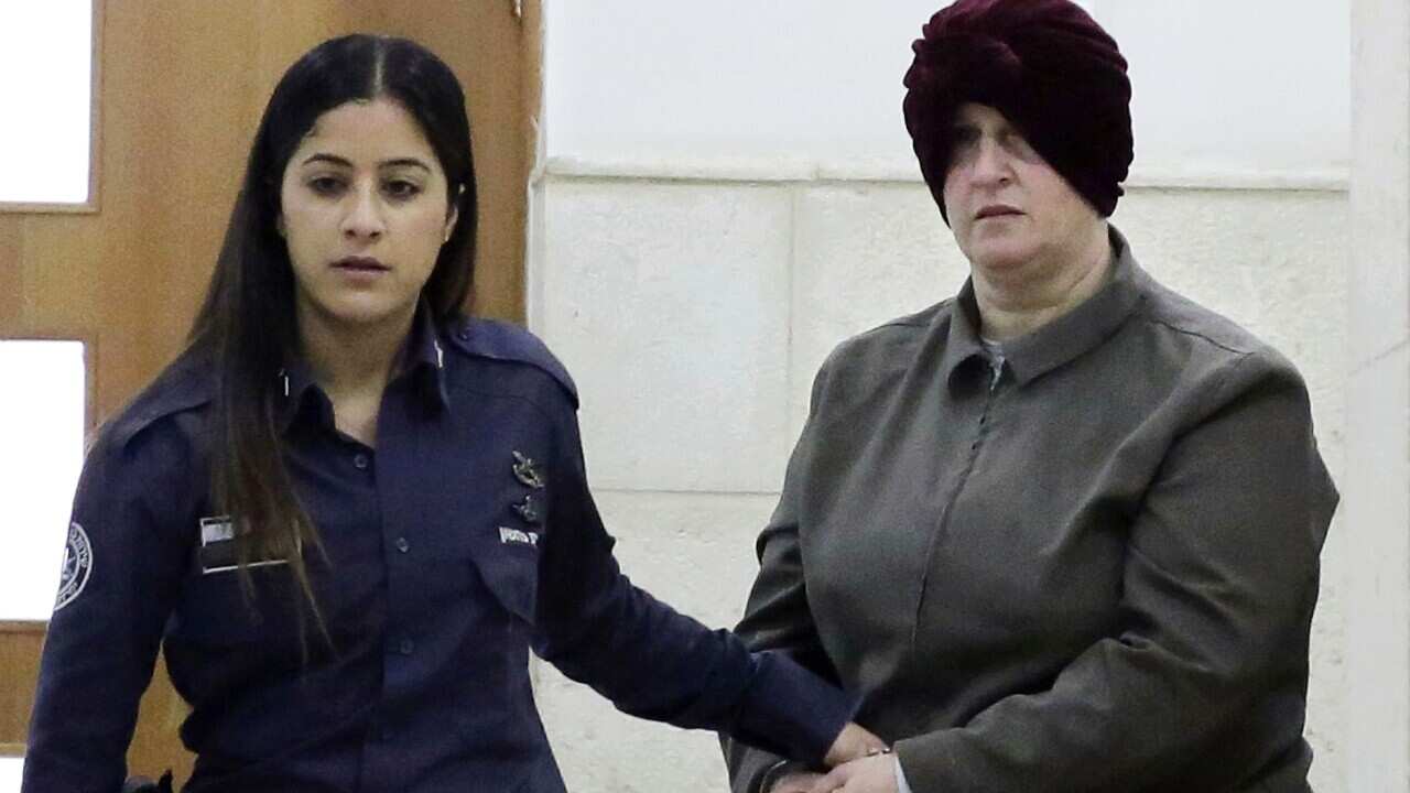 Israeli-born Australian Malka Leifer, right, is brought to a courtroom in Jerusalem in February 2018.