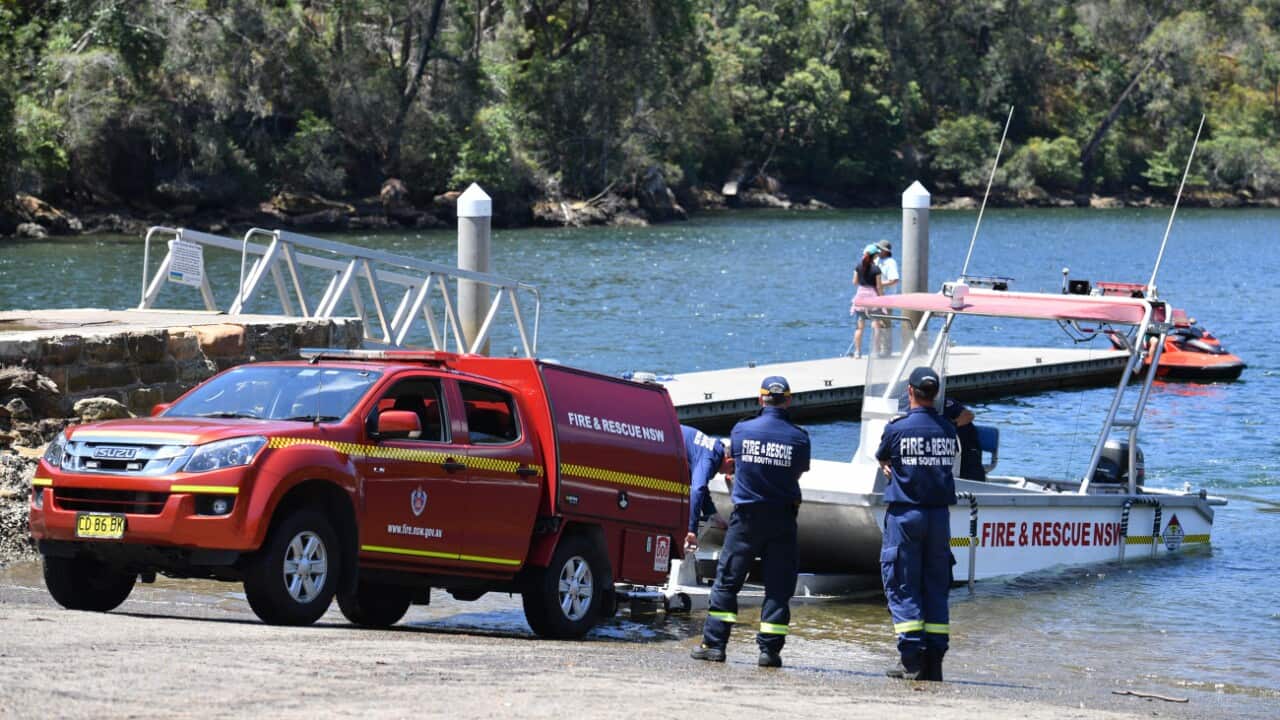 Fire & Rescue NSW personnel are seen at Apple Tree Bay boat ramp, near Bobbin Head, New South Wales.