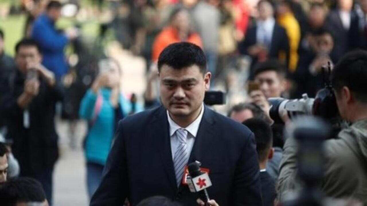 Yao Ming, a delegate and a former NBA player arrives near the Great Hall of the People before the opening session of the Chinese People's Political Consultative Conference (CPPCC) in Beijing