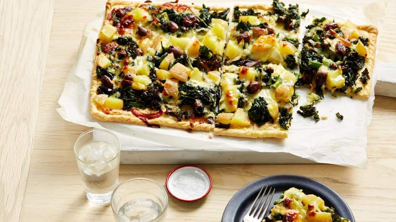 Wilted greens, potato and mozzarella tart