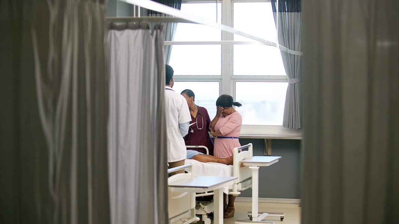Doctor sharing bad news with family member