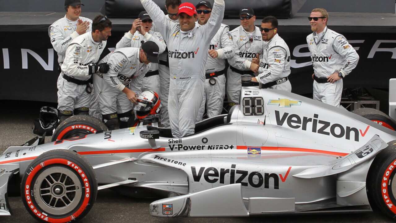 Juan Pablo Montoya celebrates after winning the IndyCar season opener