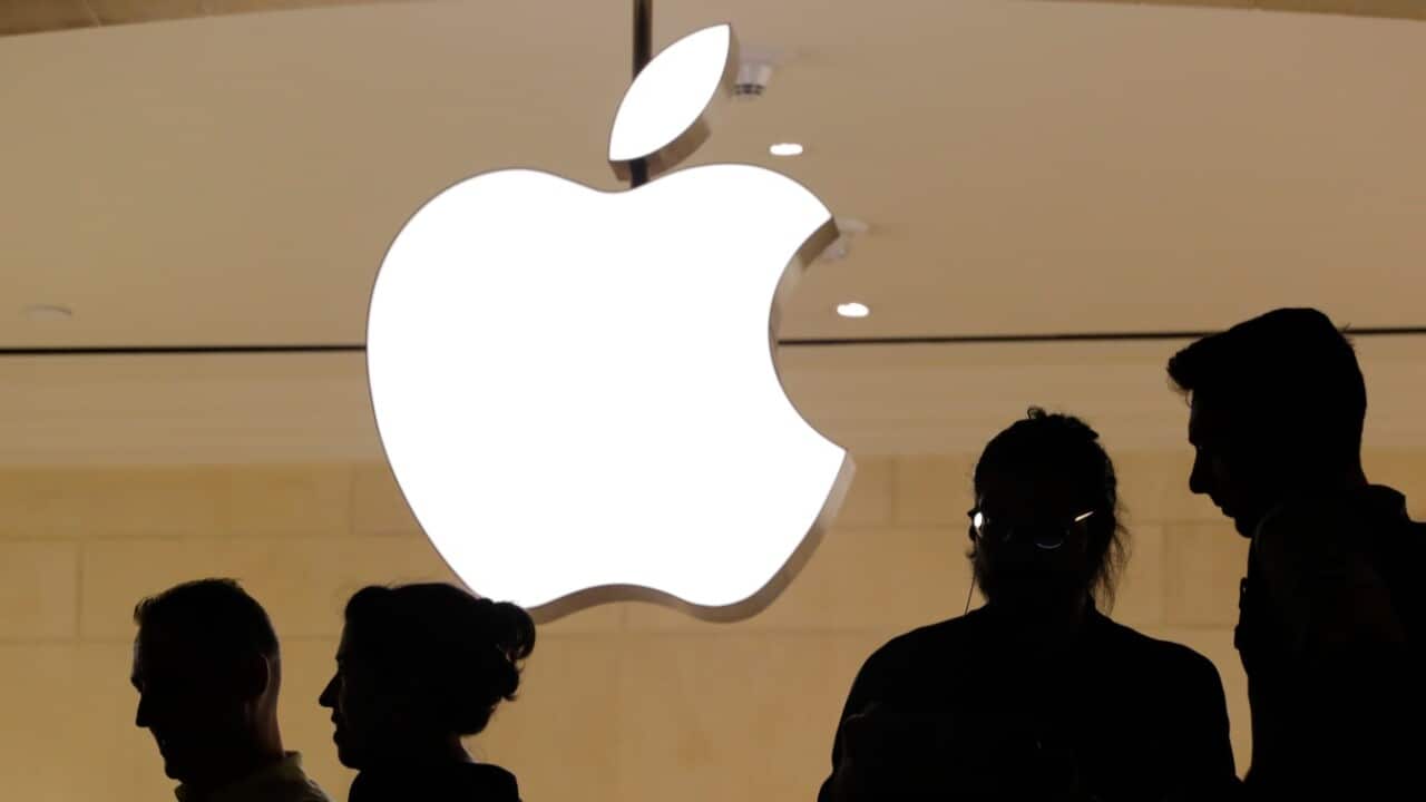 Customers enter the Apple store, Thursday, May 31, 2018
