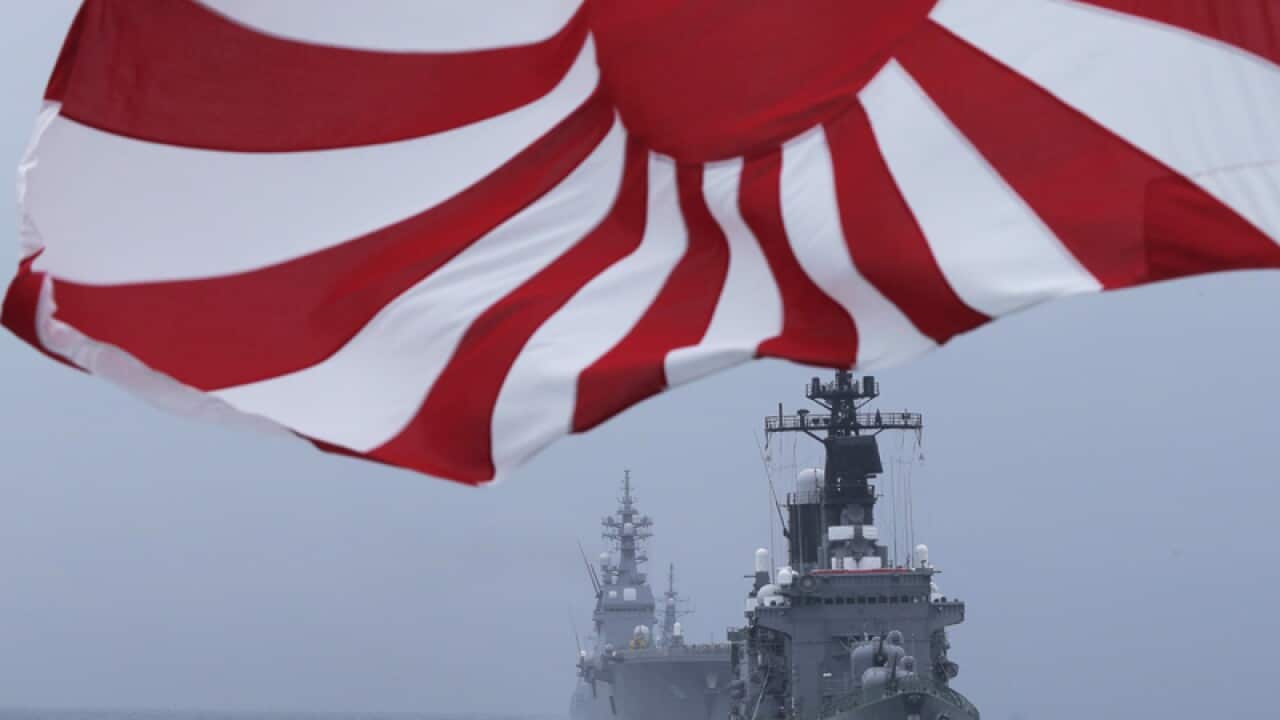 Japan Maritime Self-Defense Force (JMSDF) escort ship "Kurama" leads other vessels during a fleet review in water off Sagami Bay, south of Tokyo, Sunday, Oct. 14, 2012. (AP Photo/Itsuo Inouye)