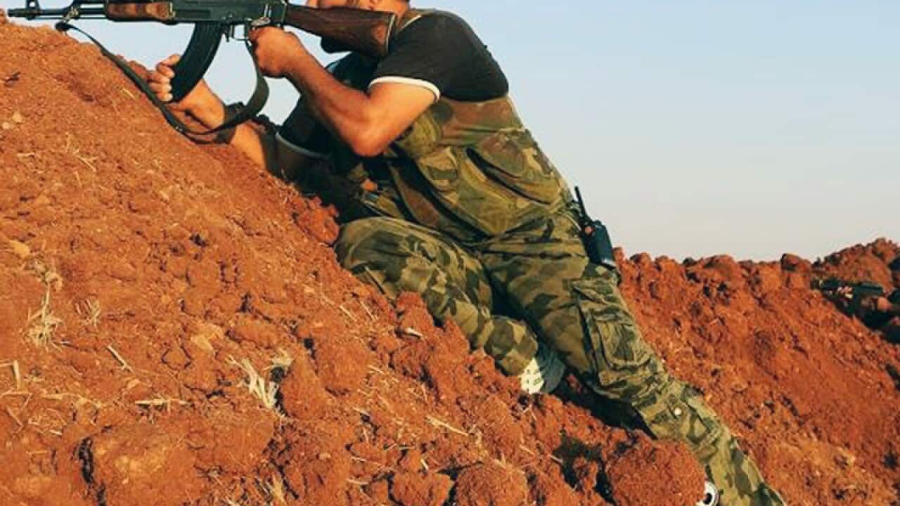 fighter during a battle with Islamic State militants in Aleppo