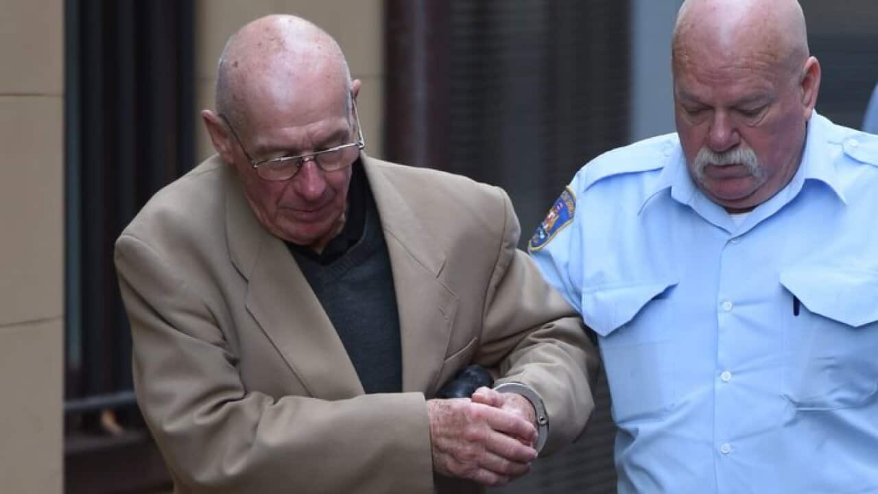Former detective Roger Rogerson is escorted to a prison van at the Supreme Court in Sydney, Wednesday, June 15, 2016. Rogerson has been found guilty of the murder of Jamie Gao.