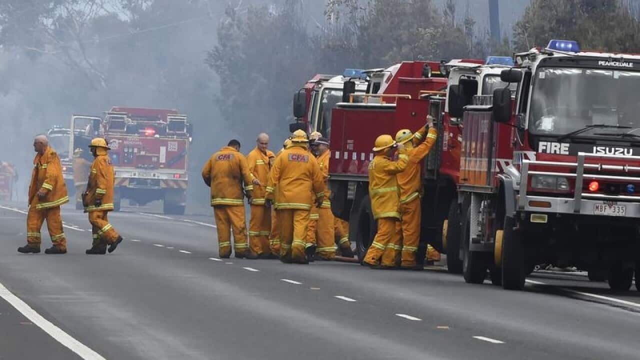 CFA officers recover while working on an out-of-control grassfire.
