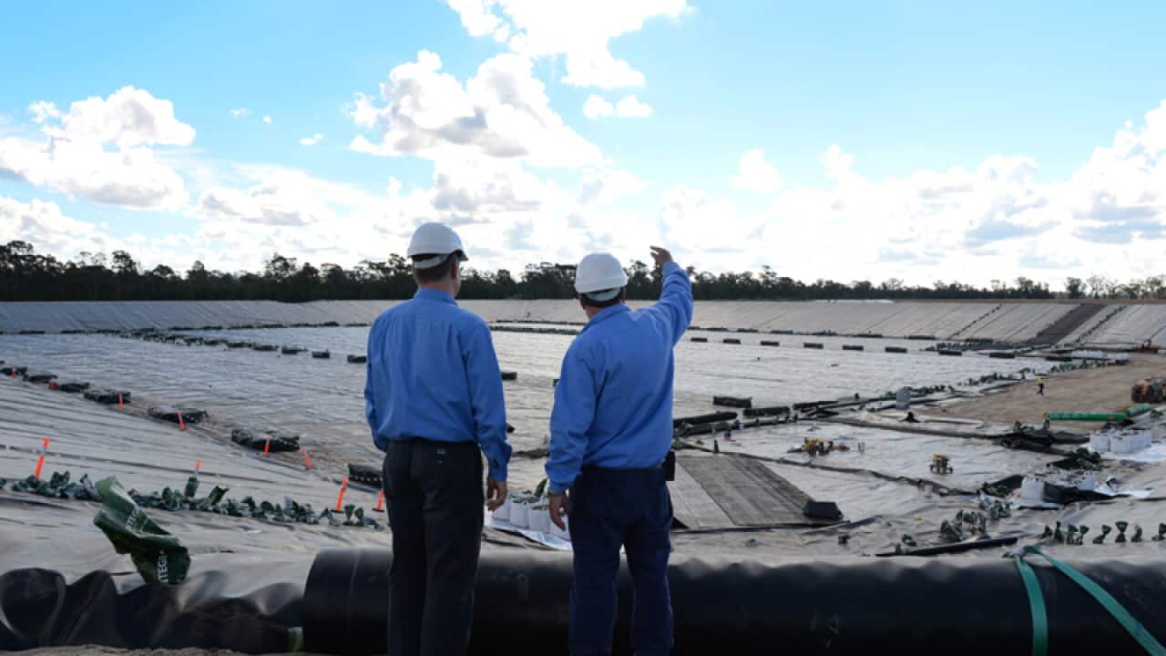 Santos staff members at a water management system construction site