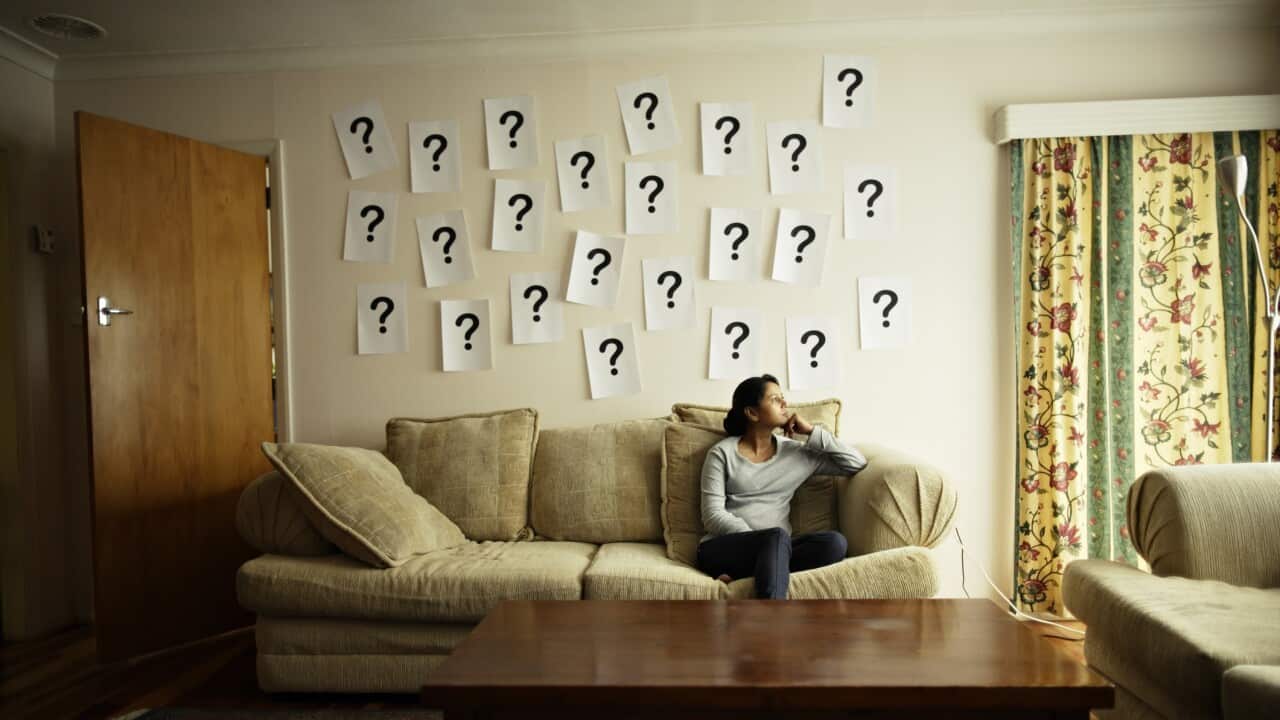 Questions mark on wall