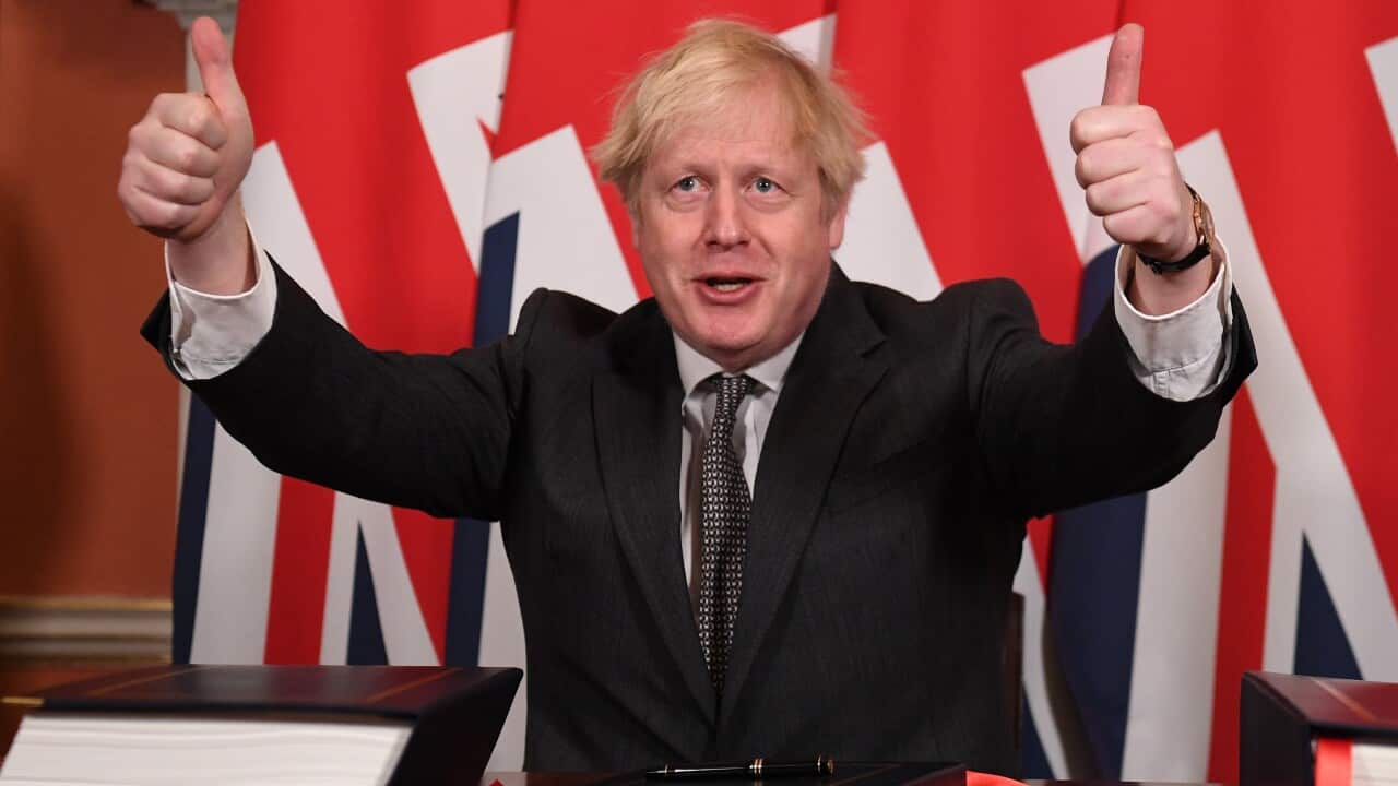 Prime Minister, Boris Johnson gives a thumbs up gesture after signing the Brexit trade deal with the EU on 20 December, 2020 in London.