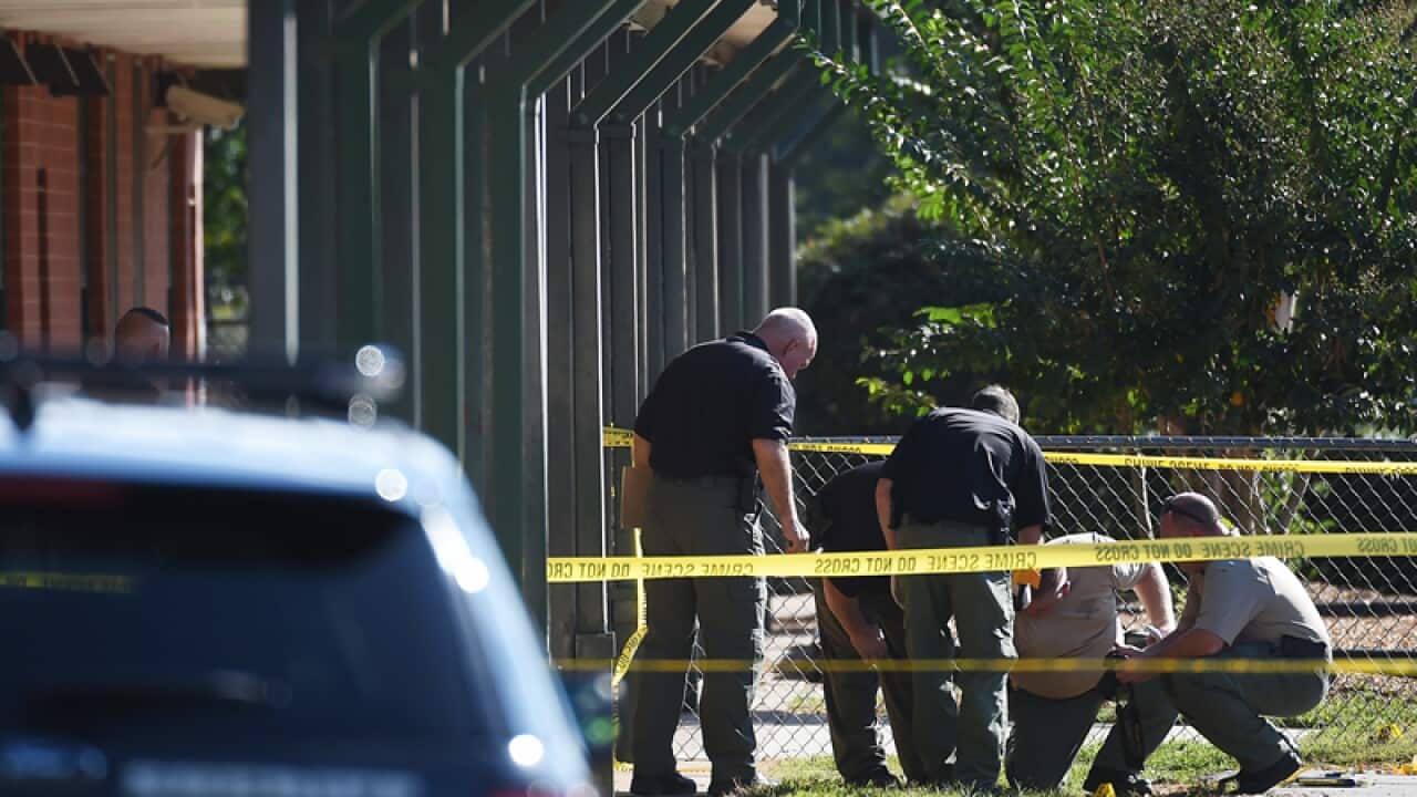 Officers investigate the scene of a shooting in South Carolina